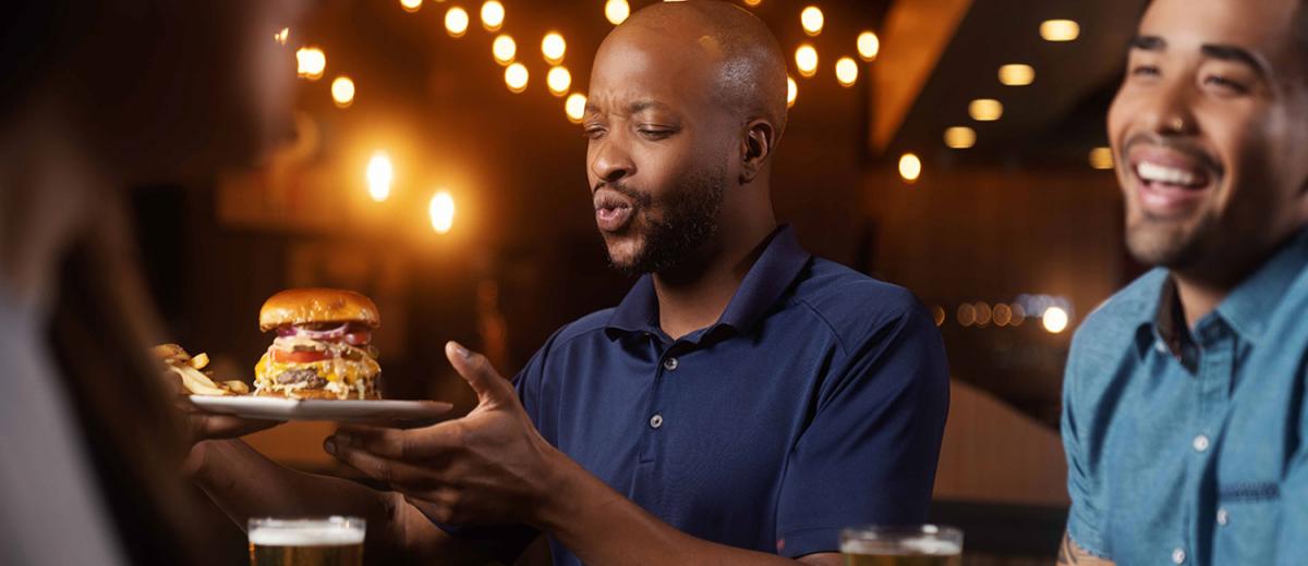 Men with beer and burgers